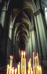 Candles Burn Inside European Cathedral